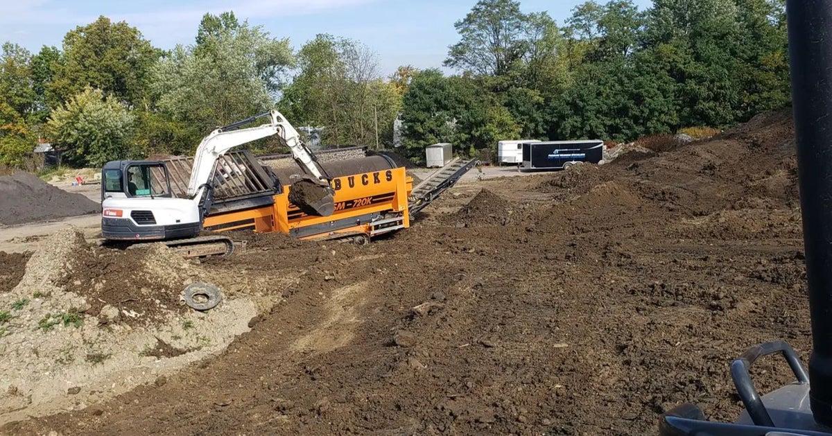 Warbucks excavator and screening equipment on an excavation and sitework project